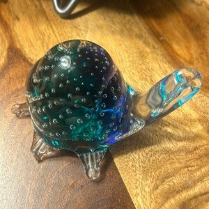 Glass paperweight of a turtle. Bubbles inside blue and green colors